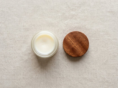 Top-down view of open Board Butter jar and round Sapele wood lid