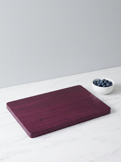 Purple heart cutting board with fresh blueberries