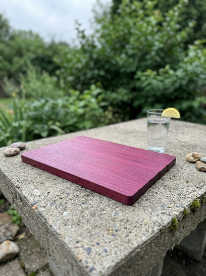 Purple heart cutting board outdoor patio concrete table
