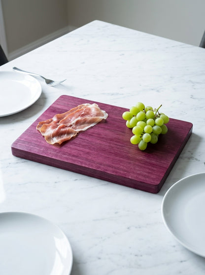 Purple heart cutting board serving prosciutto grapes dinner