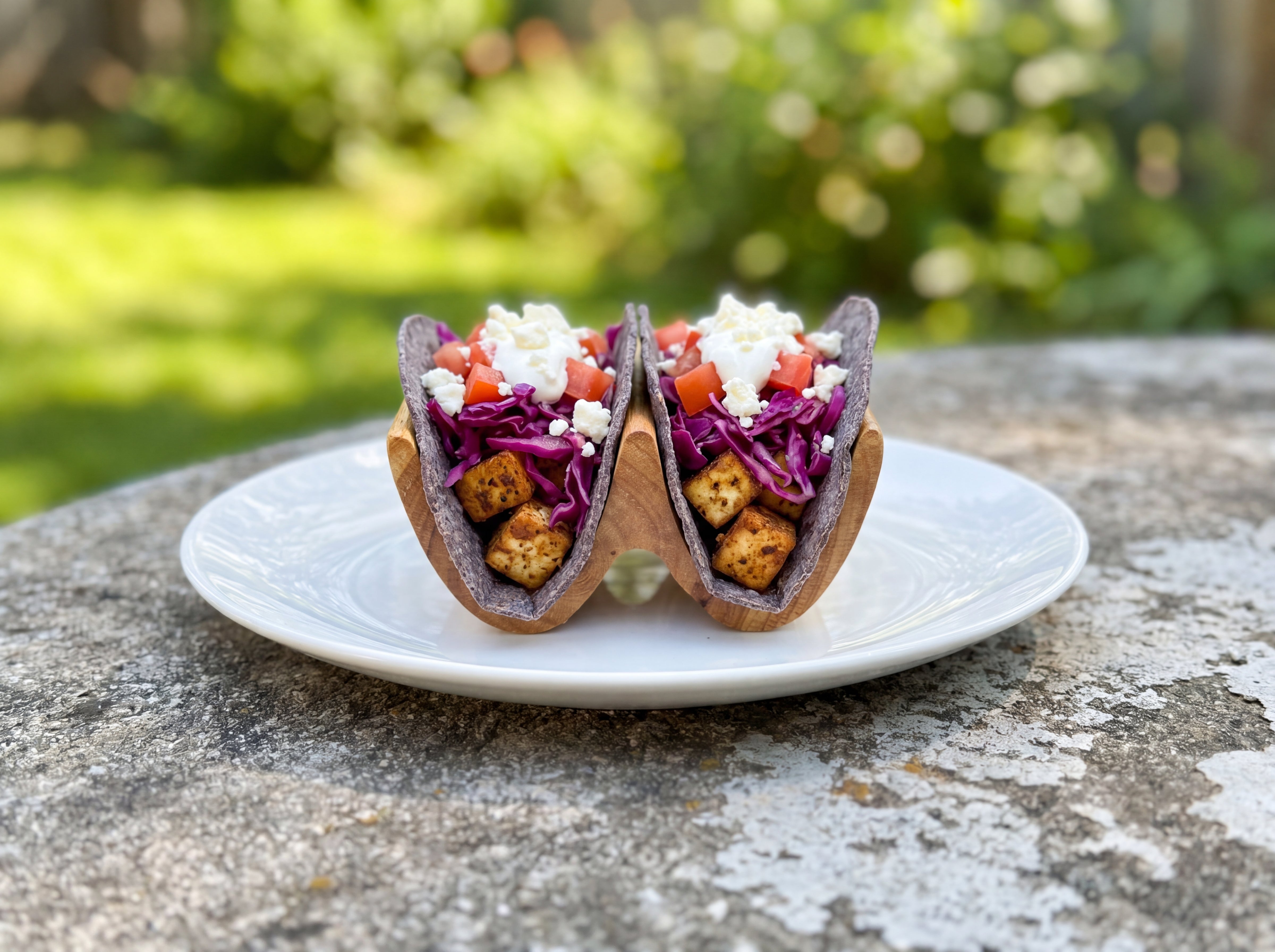 Handcrafted double taco holder with loaded tacos outdoors